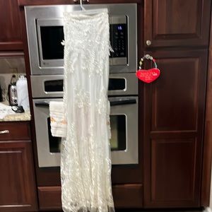 Woman’s white lace wedding gown